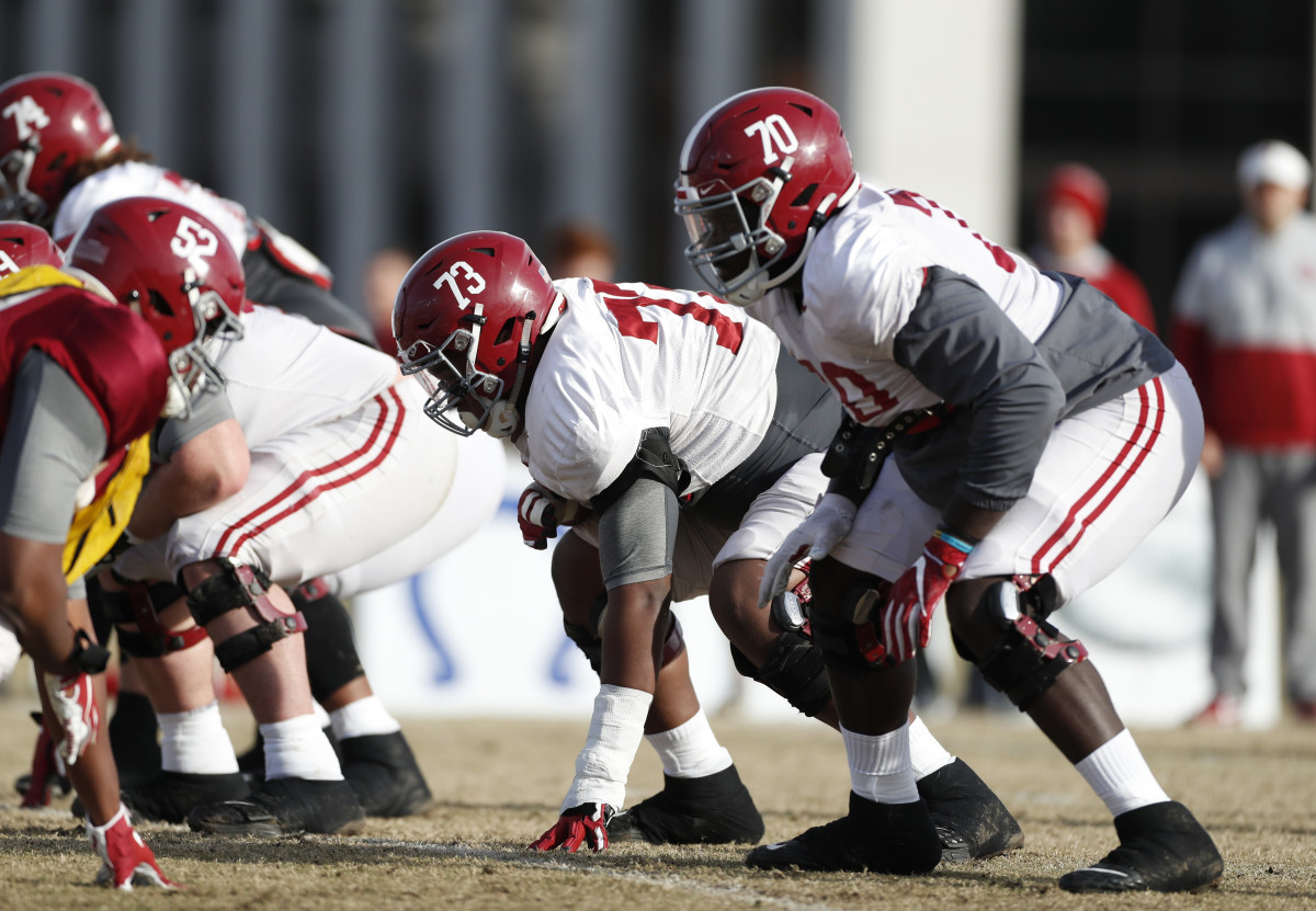 Alabama offensive linemen Evan Neal and Alex Leatherwood